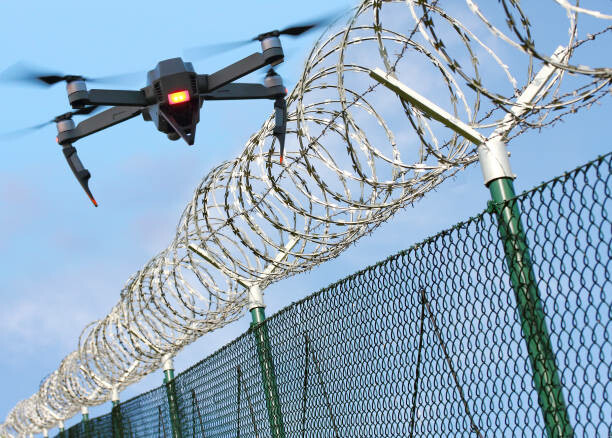 Drone hovering over perimeter wall