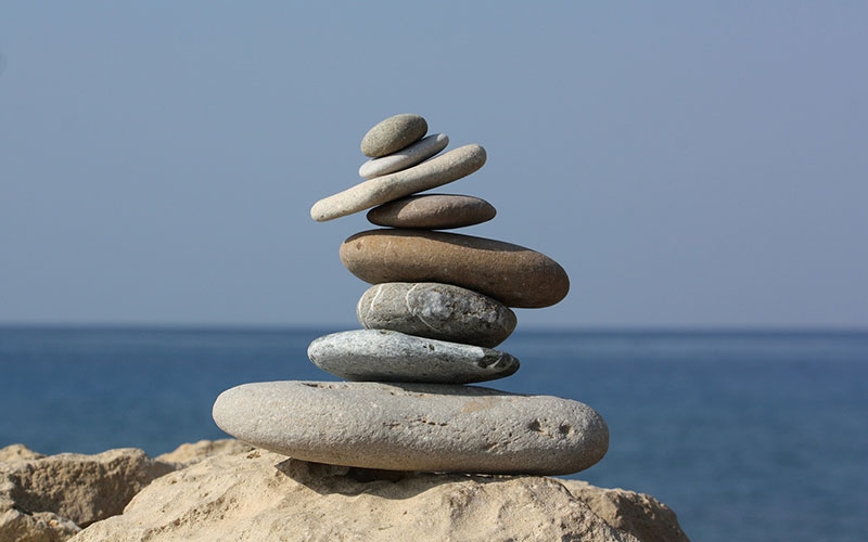 A pile of rocks by the coastline