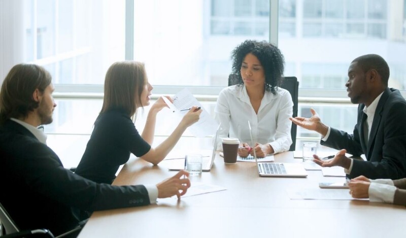 Colleagues sharing ideas in a meeting