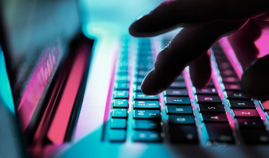 Hand typing at keyboard