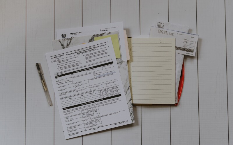A display of self-employment tax forms on the table