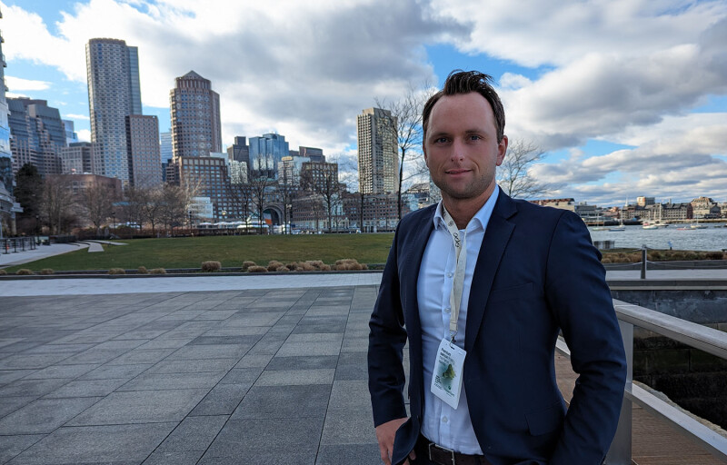 Ode CEO Ola Kvalheim standing with a cityscape behind him in Boston