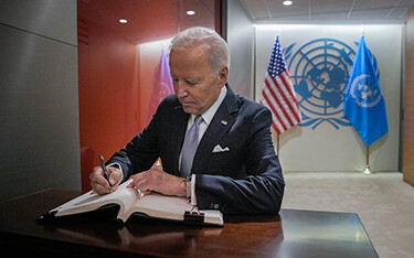 U.S. President Joe Biden signs a guestbook at the United Nations.