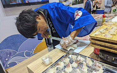 A chef from Japan cutting fish at Seafood Expo Asia