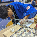 A chef from Japan cutting fish at Seafood Expo Asia