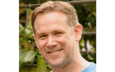 A headshot of Peter Battisti.