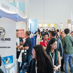 Groups of people walking in the aisle of Seafood Expo Asia.