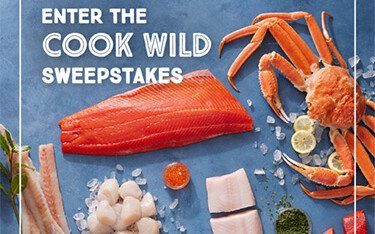 An advertisement for the Alaska Seafood Marketing Institute's "Cook Wild" sweepstakes.