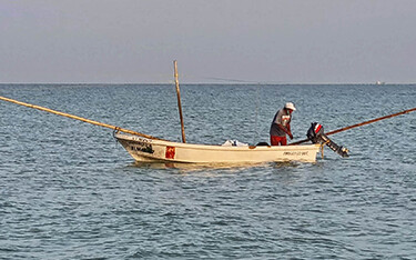 A Yucatan octopus fisherman on his boat.