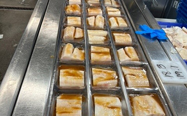 A processing line of Alaskan Leader black cod.