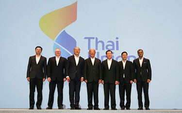 Thai Union executives standing on stage at an event.