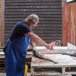 A fisherman in Canada cleaning a recently caught cod.