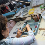 A person demonstrating cultured pearl production in Japan.