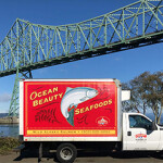 An Ocean Beauty Seafood distribution truck near a bridge in Astoria, Oregon.