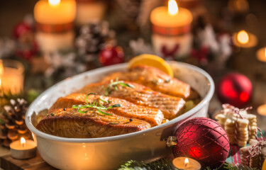 Salmon dish with a Christmas-themed background.
