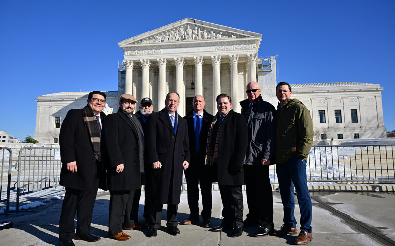 A photo of the plaintiffs at the Supreme Court.