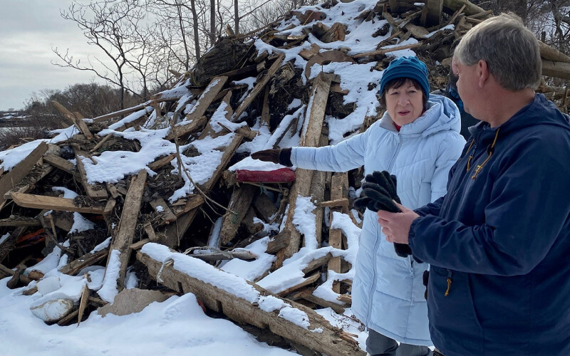 A photo of U.S. Senator Susan Collins (R-Maine) assessing storm damage.