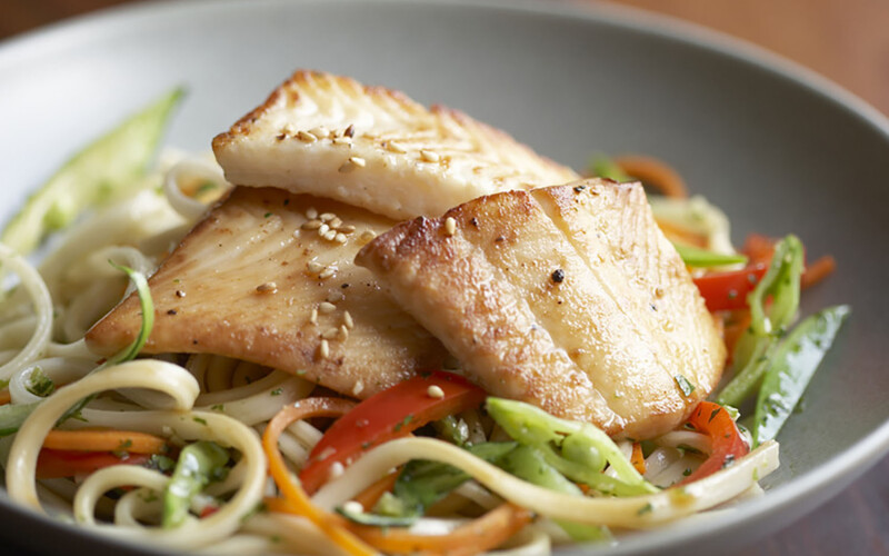 Alaska sole on a bed of vegetables.