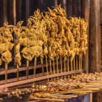 Fried squid skewers at a market in China