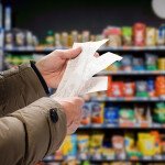 A shopper looking at receipts
