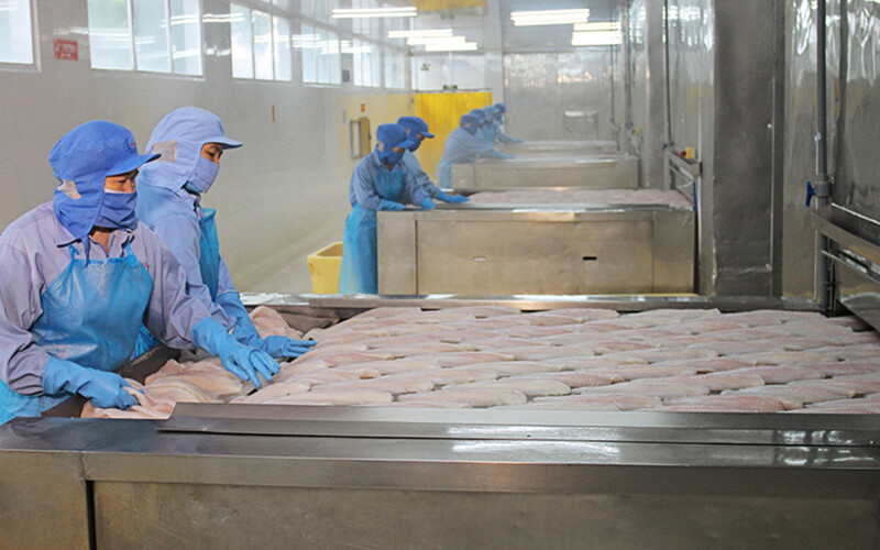 Workers at a Can Tho Import-Export Seafood Joint Stock Company facility
