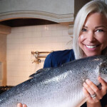 GiGi 'The Salmon Queen' holding salmon
