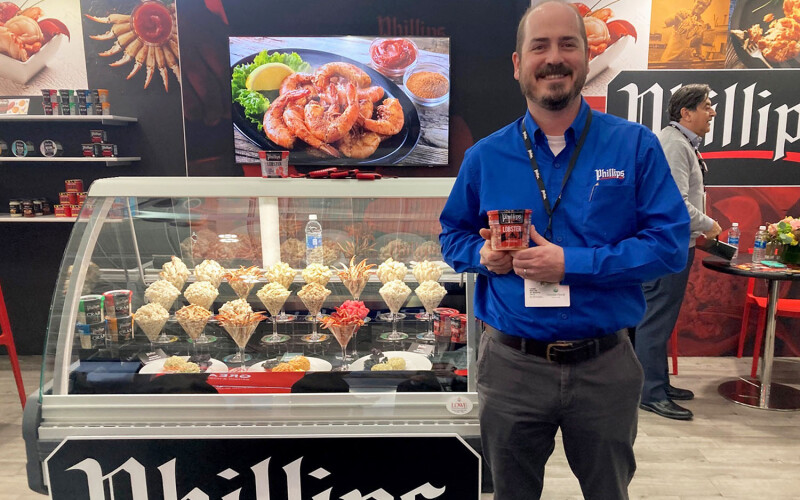 Phillips Foods Vice President of Sustainability Brice Phillips at the company's booth at Seafood Expo North America