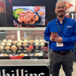 Phillips Foods Vice President of Sustainability Brice Phillips at the company's booth at Seafood Expo North America