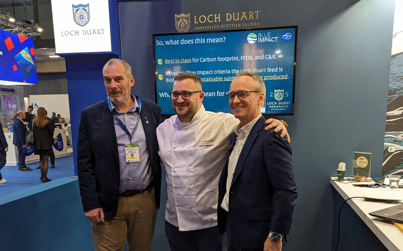 BioMar and Loch Duart employees pose in the company's booth at the 2024 Seafood Expo Global