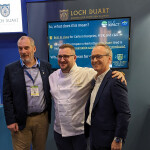 BioMar and Loch Duart employees pose in the company's booth at the 2024 Seafood Expo Global
