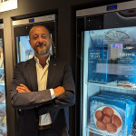 Frime President Salvador Ramon inside the company's booth at Seafood Expo Global