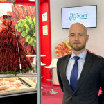 Alfocan General Manager Nicolas Roux standing in the company's booth at Seafood Expo Global