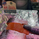 Pieces of salmon on display near a Label Rouge label