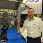 BAADER North America CEO Nils Rabe poses next to one of the company's machines