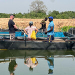 ASC employees working in Ghana at a fishery